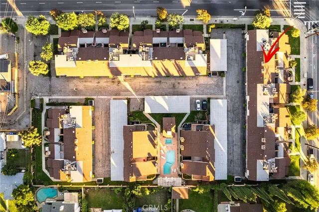an aerial view of residential houses with outdoor space