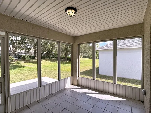a view of an empty room with windows