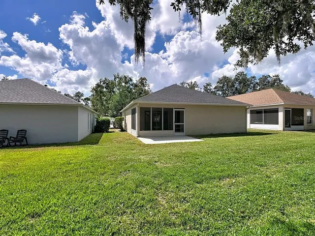 a backyard of a house with lots of green space