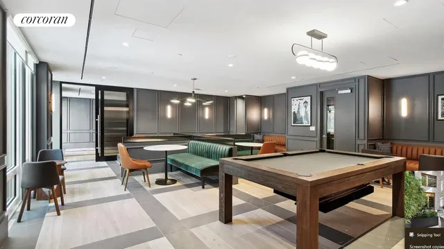 a view of a building with table and chairs