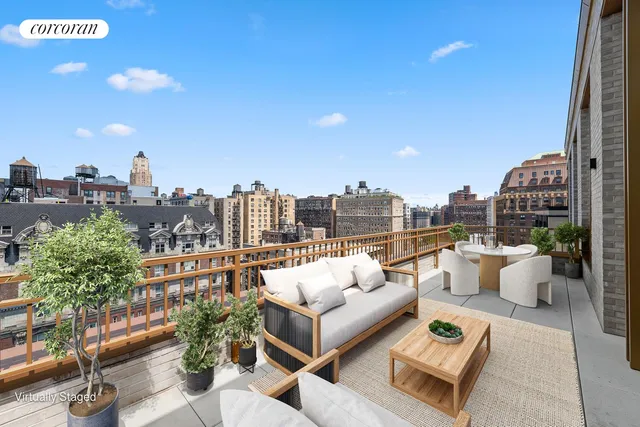 a kitchen with a sink cabinets and wooden floor