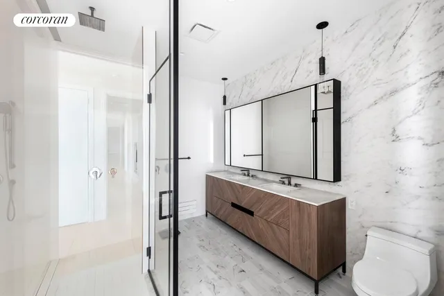 a bedroom with furniture and a large window