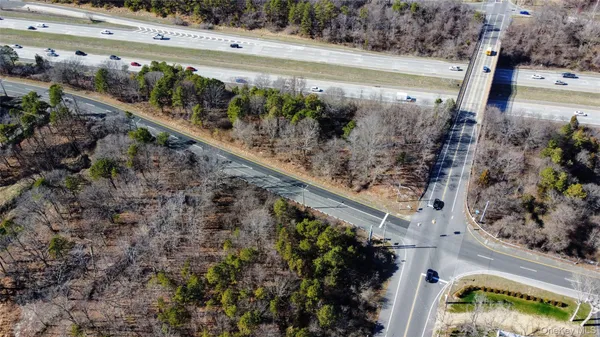 a view of a lake with a mountain and a yard