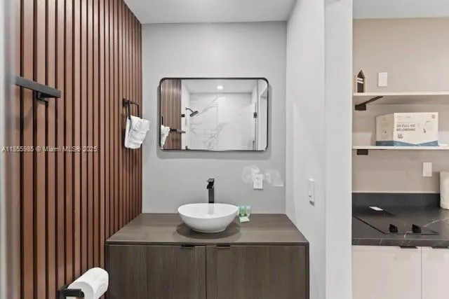 a bathroom with a sink toilet and mirror