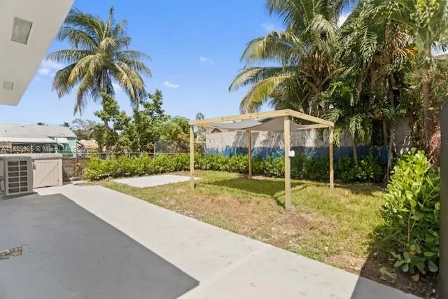 a house with palm tree in front of it