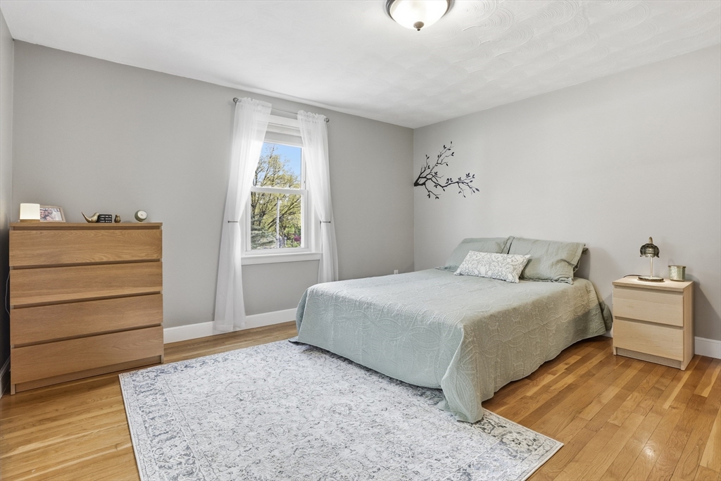 115 Collincote Street Stoneham, MA 02180 - Photo 12 of 25 a bedroom with a bed and a window