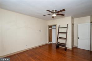 1618 Roundhill Road Baltimore, MD 21218 - Photo 19 of 47 a view of empty room with wooden floor and fan