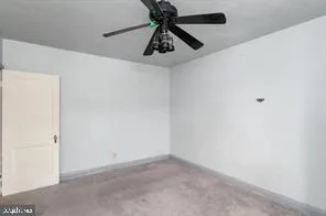 a view of a chandelier fan in a room