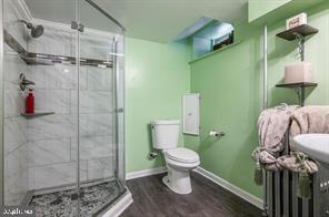 1618 Roundhill Road Baltimore, MD 21218 - Photo 32 of 47 a bathroom with a toilet and a shower