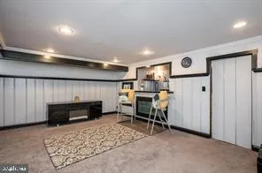a view of a livingroom with furniture and a fireplace