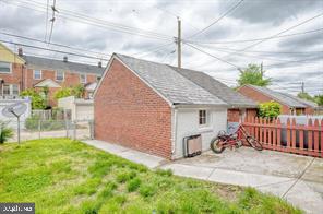 1618 Roundhill Road Baltimore, MD 21218 - Photo 44 of 47 a front view of a house with garden
