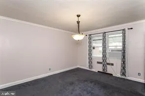 a view of empty room with ceiling fan