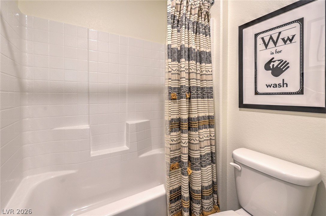 1017 Copper Robin Street Henderson, NV 89011 - Photo 35 of 43 Photo is representational only; actual home finishes may vary. Bathroom with toilet and shower / bath combo