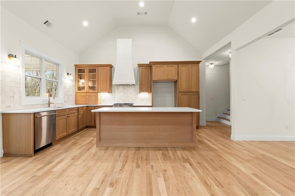 2020 Darby Road Waleska, GA 30183 - Photo 11 of 49 a large kitchen with kitchen island granite countertop a sink and white cabinets