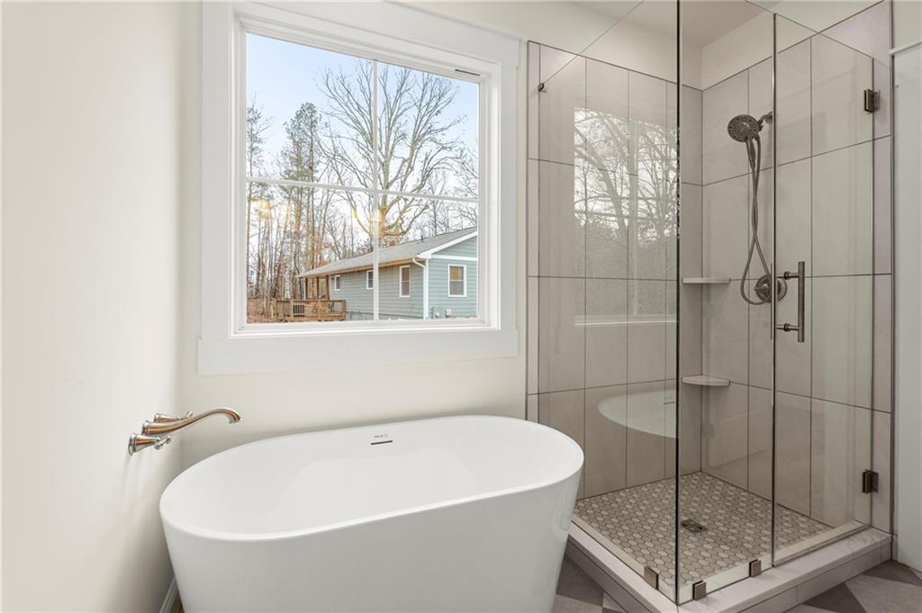 2020 Darby Road Waleska, GA 30183 - Photo 27 of 49 a white bath tub sitting next to a shower