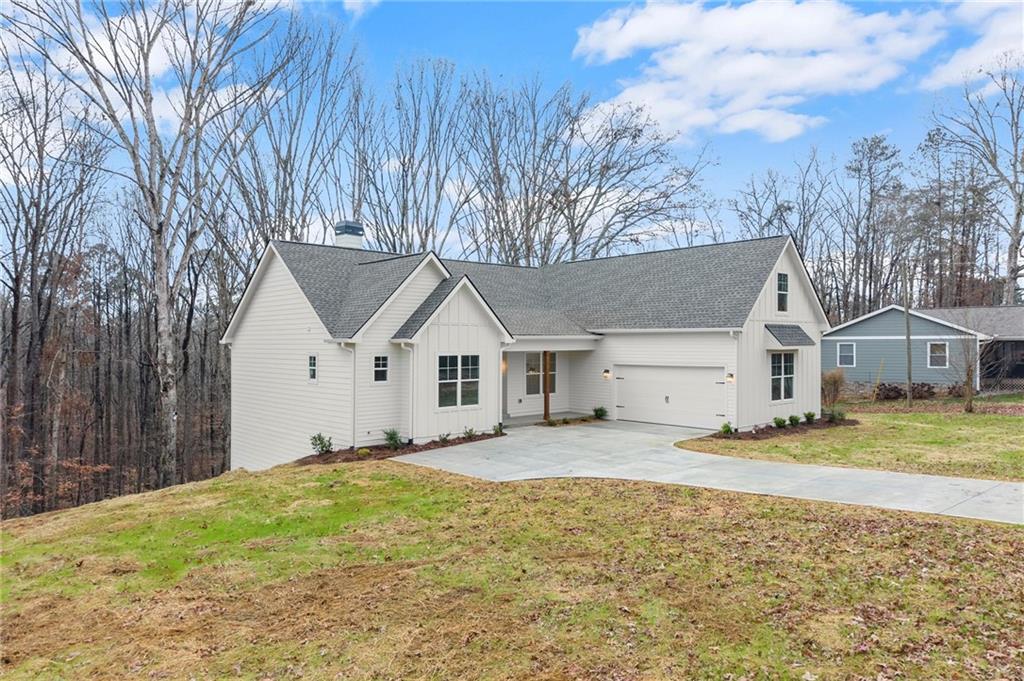 2020 Darby Road Waleska, GA 30183 - Photo 3 of 49 a front view of a house with a yard