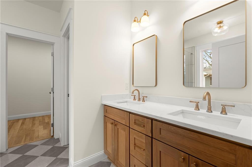 2020 Darby Road Waleska, GA 30183 - Photo 32 of 49 a bathroom with a double vanity sink and a mirror