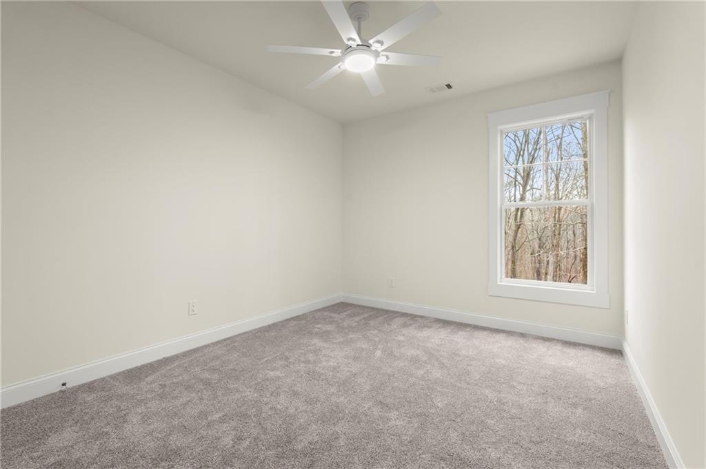 2020 Darby Road Waleska, GA 30183 - Photo 35 of 49 an empty room with a window and a fan