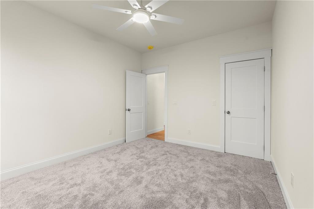 2020 Darby Road Waleska, GA 30183 - Photo 36 of 49 an empty room with a fan and a window