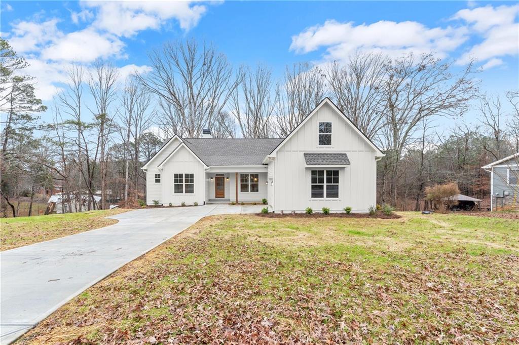 2020 Darby Road Waleska, GA 30183 - Photo 43 of 49 a front view of a house with a yard and garage
