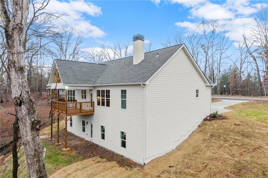 2020 Darby Road Waleska, GA 30183 - Photo 45 of 49 a view of a white house with a yard and large tree