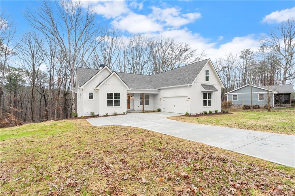 2020 Darby Road Waleska, GA 30183 - Photo 47 of 49 a view of a house with snow on the road