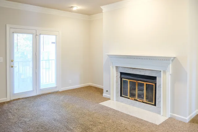 a view of empty room with a fireplace
