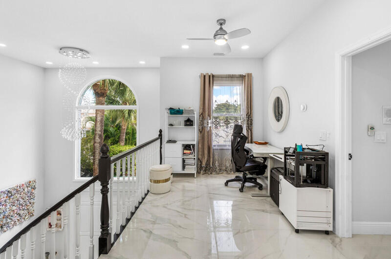 7748 Travelers Tree Drive Boca Raton, FL 33433 - Photo 14 of 31 a very nice looking room with a large window