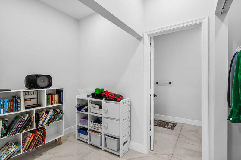 7748 Travelers Tree Drive Boca Raton, FL 33433 - Photo 22 of 31 a view of a walk in closet
