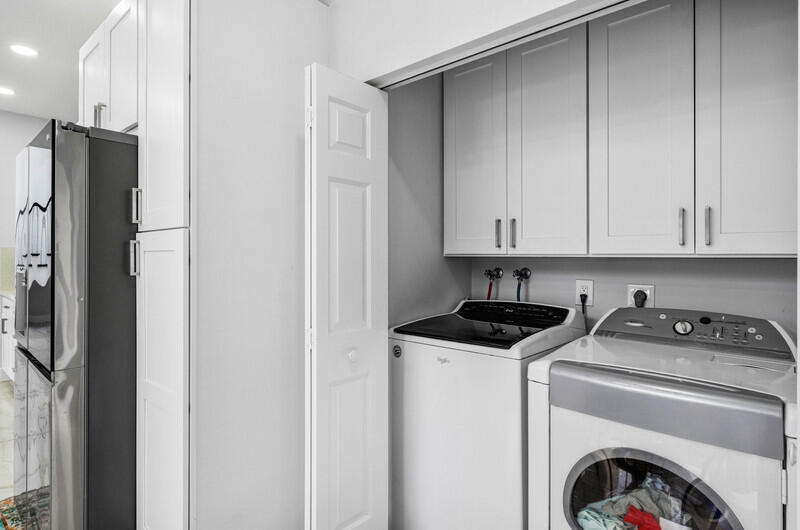 7748 Travelers Tree Drive Boca Raton, FL 33433 - Photo 24 of 31 a utility room with sink dryer and washer