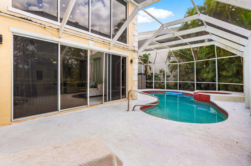 7748 Travelers Tree Drive Boca Raton, FL 33433 - Photo 26 of 31 a view of a house with a swimming pool