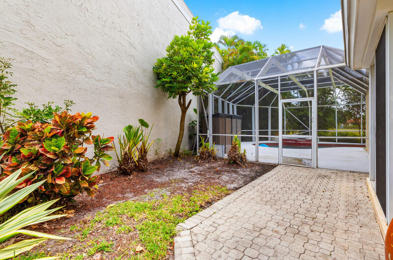 7748 Travelers Tree Drive Boca Raton, FL 33433 - Photo 28 of 31 a house view with a garden space