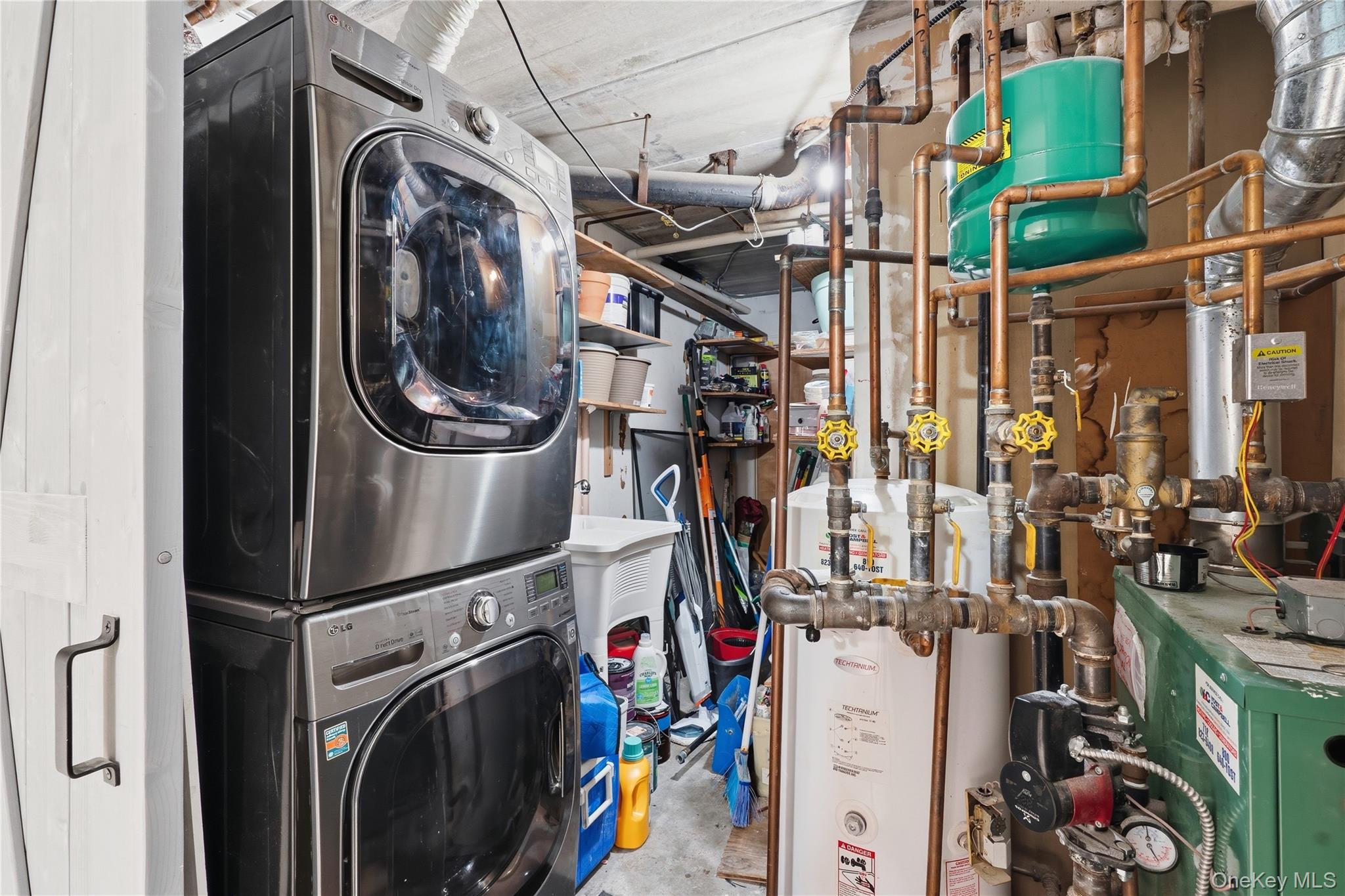863 Home Street Bronx, NY 10459 - Photo 13 of 46 a utility room with dryer and washer