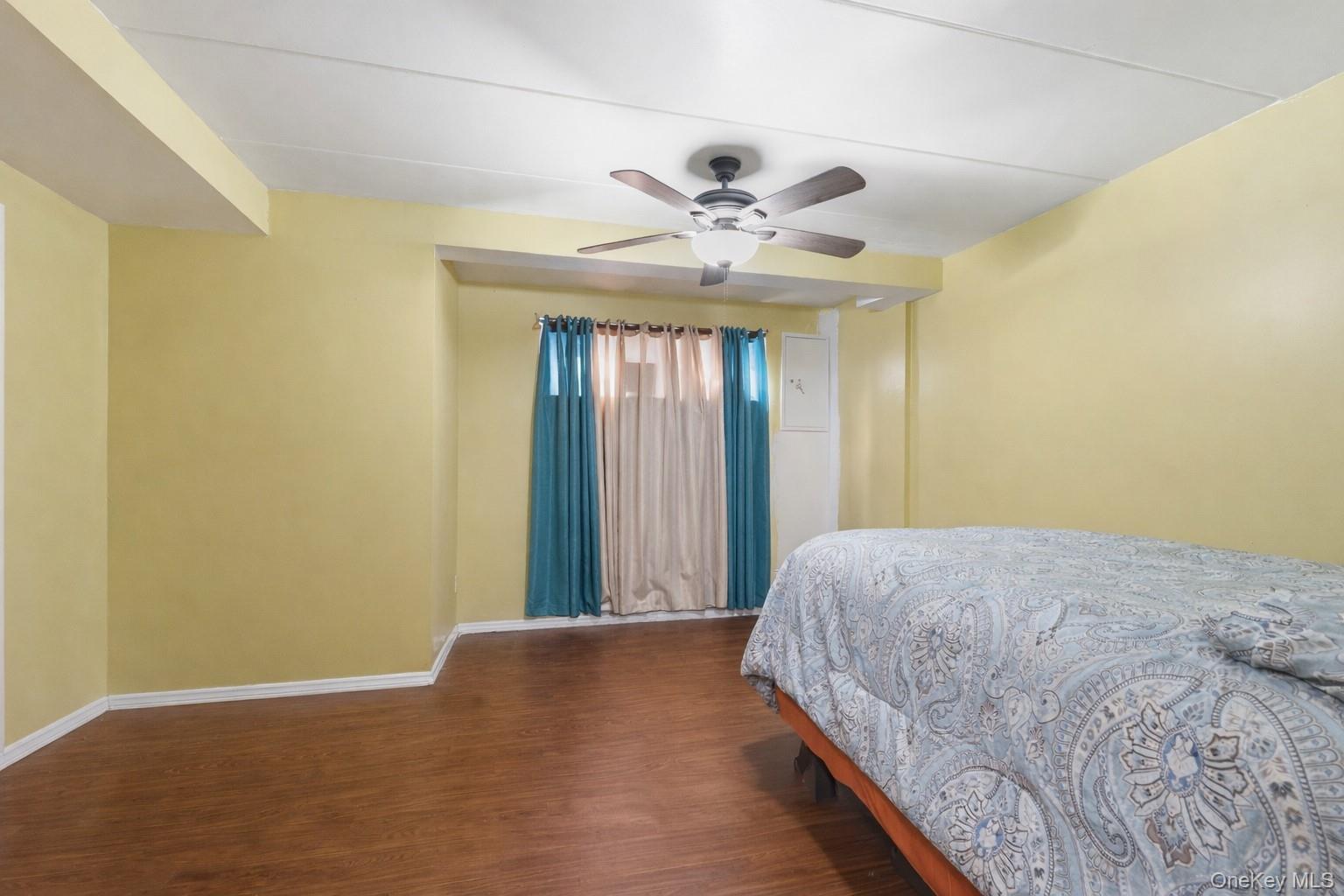863 Home Street Bronx, NY 10459 - Photo 14 of 46 a bedroom with a bed and a window
