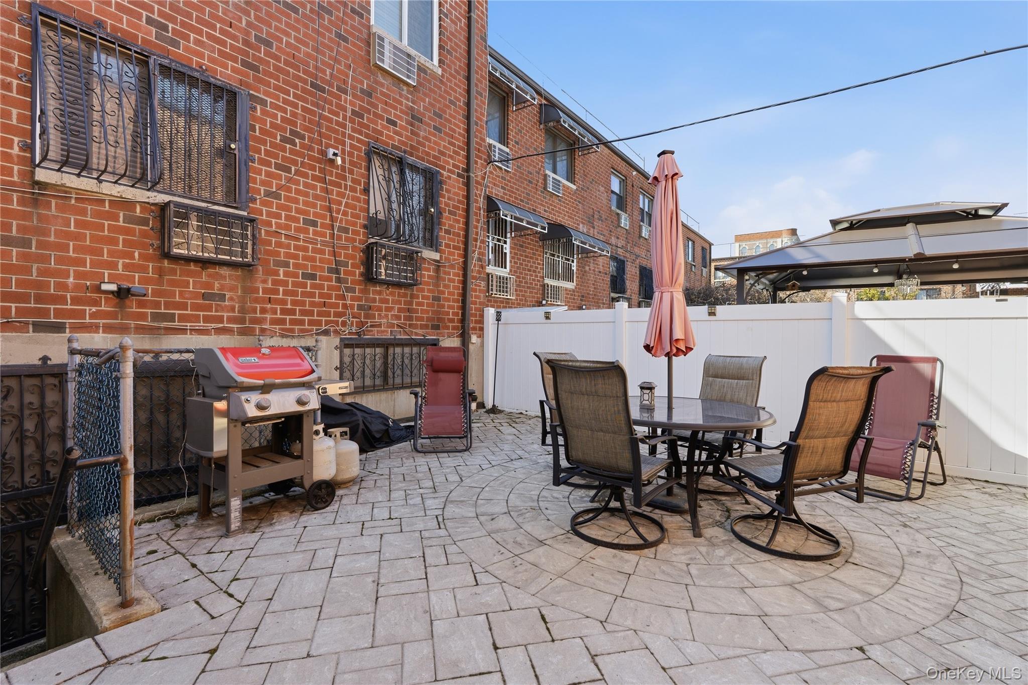 863 Home Street Bronx, NY 10459 - Photo 18 of 46 a view of a dinning tables and chairs in the patio