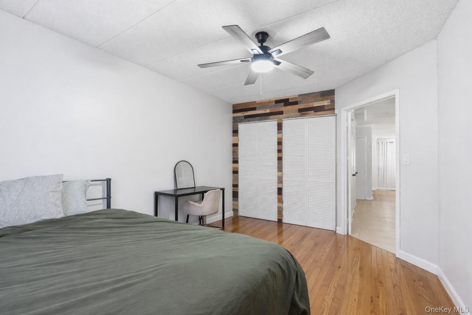 863 Home Street Bronx, NY 10459 - Photo 25 of 46 a bedroom with a bed and a chandelier