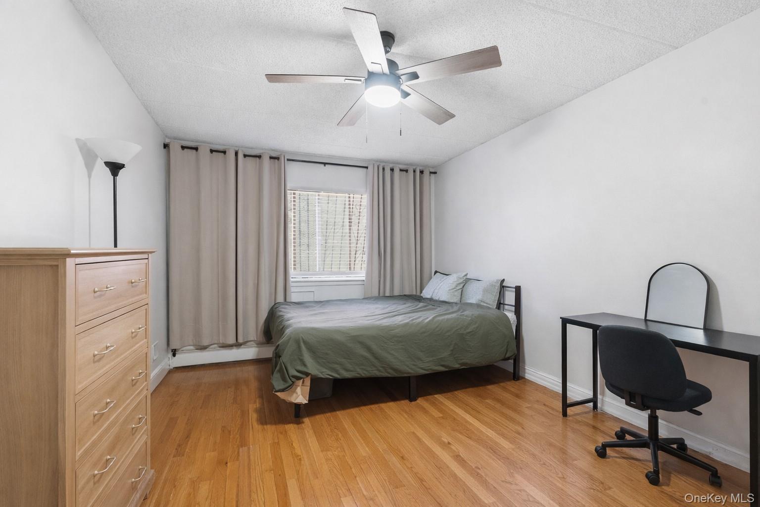 863 Home Street Bronx, NY 10459 - Photo 26 of 46 a bedroom with a bed and a dresser