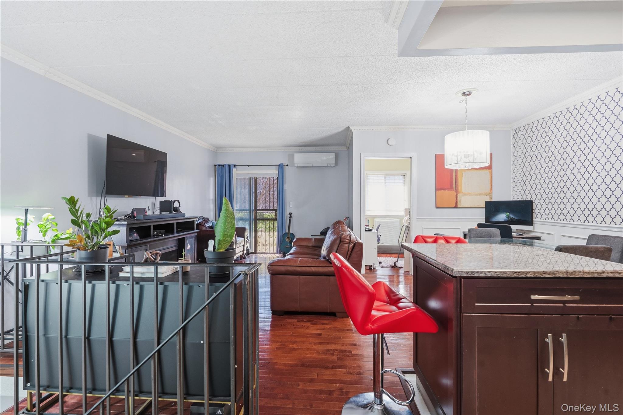 863 Home Street Bronx, NY 10459 - Photo 28 of 46 a living room with furniture a flat screen tv and a dining table