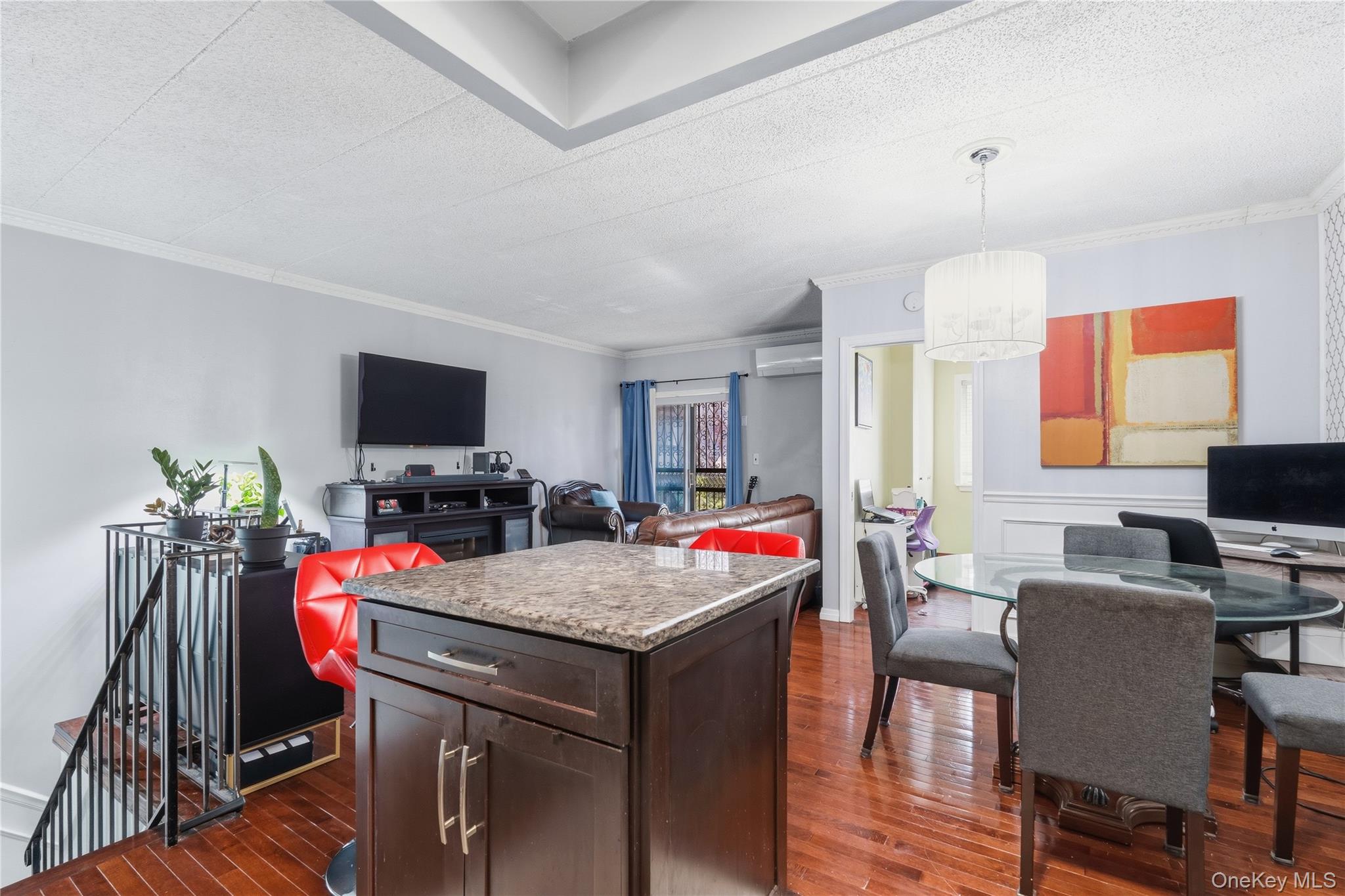 863 Home Street Bronx, NY 10459 - Photo 30 of 46 a view of a dining room with furniture and a flat screen tv