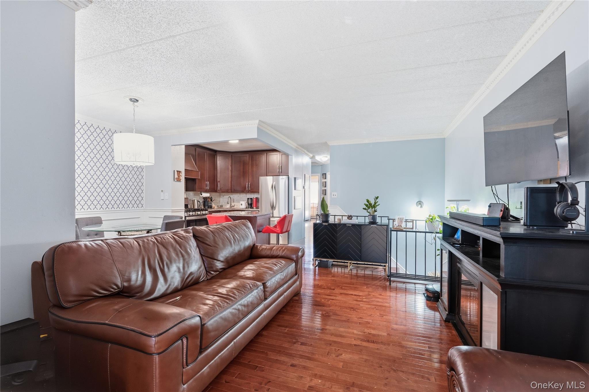 863 Home Street Bronx, NY 10459 - Photo 34 of 46 a living room with furniture and a wooden floor