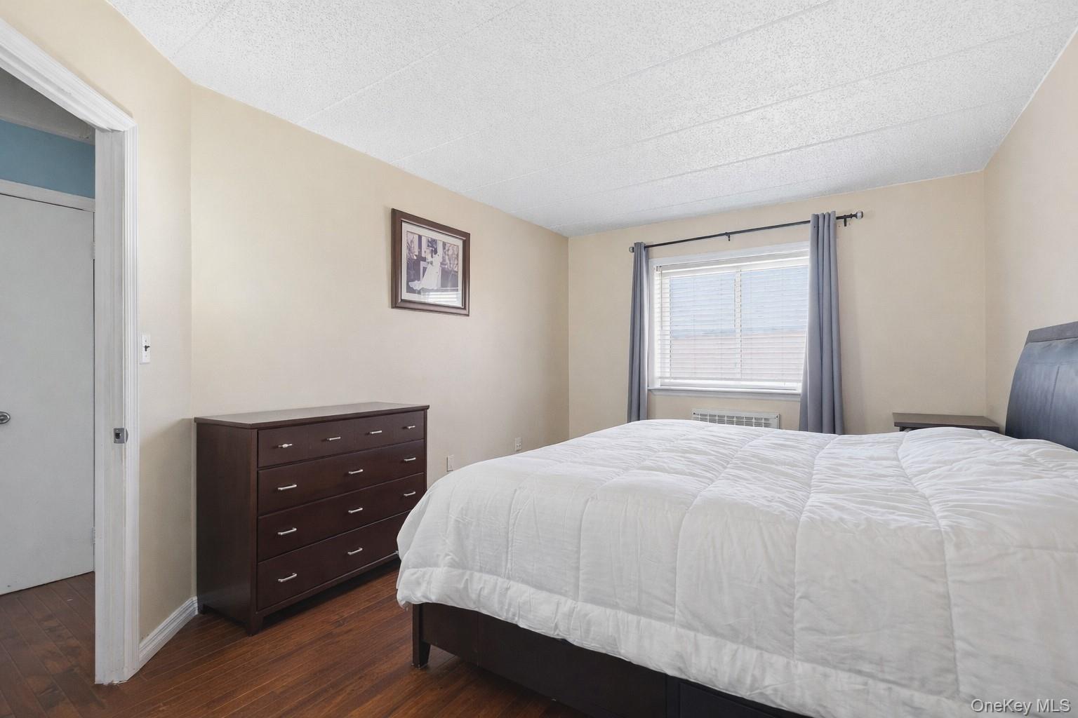 863 Home Street Bronx, NY 10459 - Photo 40 of 46 a bedroom with a bed and a window