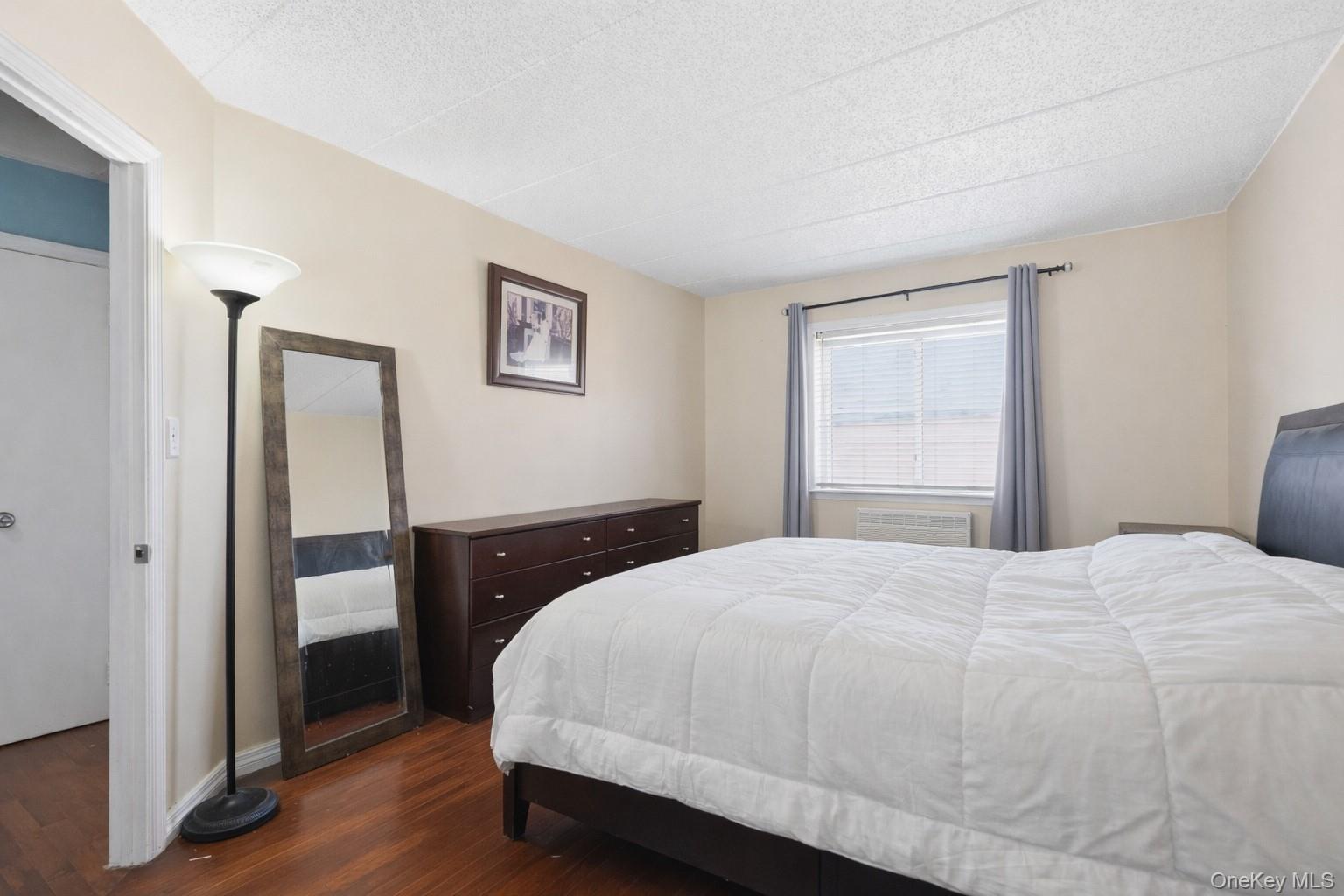 863 Home Street Bronx, NY 10459 - Photo 41 of 46 a bedroom with a bed and a window
