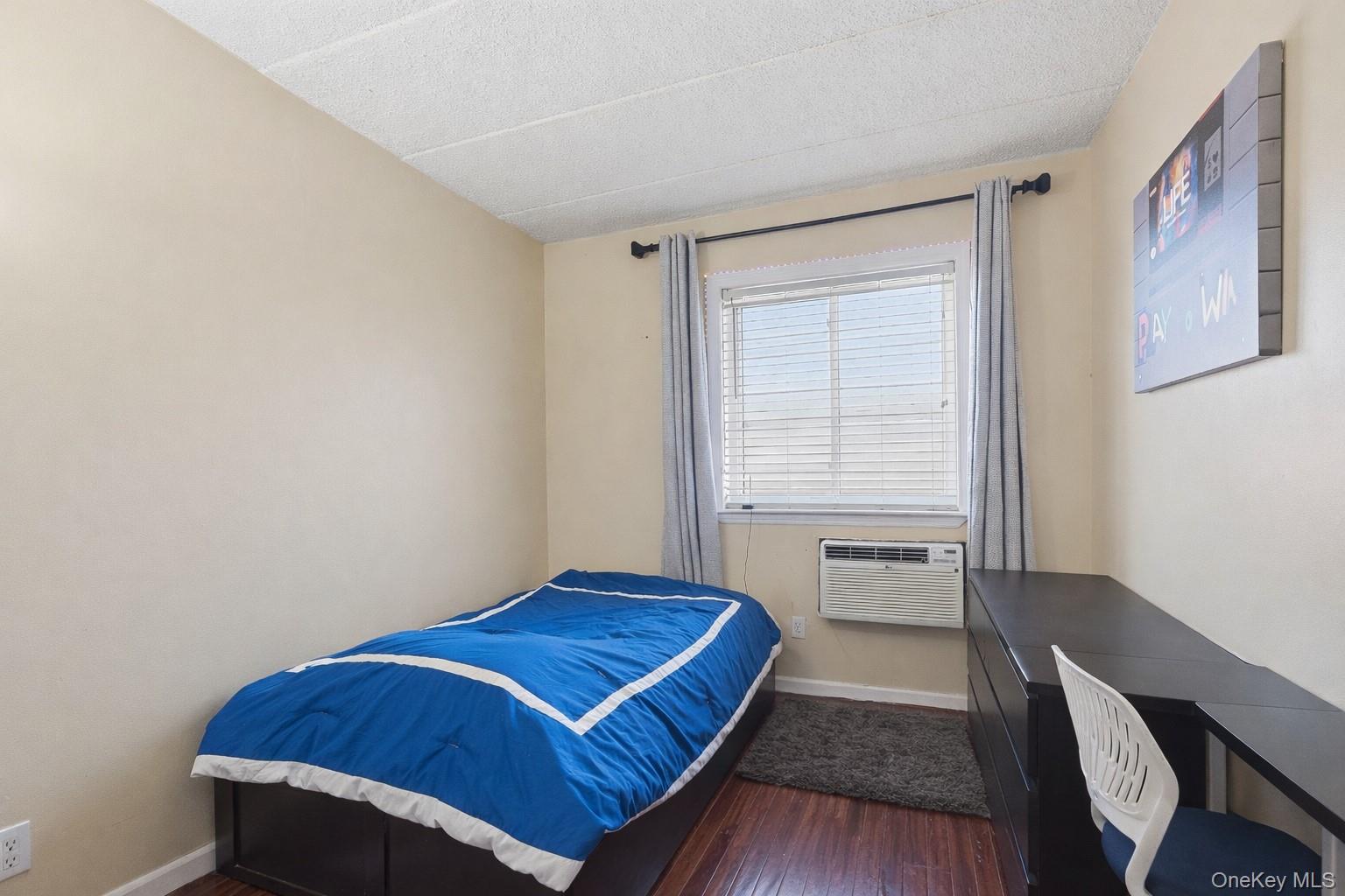863 Home Street Bronx, NY 10459 - Photo 43 of 46 a bedroom with a bed and a window