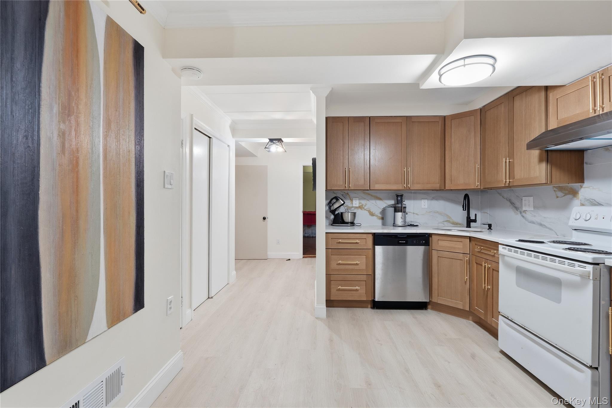 863 Home Street Bronx, NY 10459 - Photo 5 of 46 a kitchen with stainless steel appliances granite countertop a stove a sink and a refrigerator