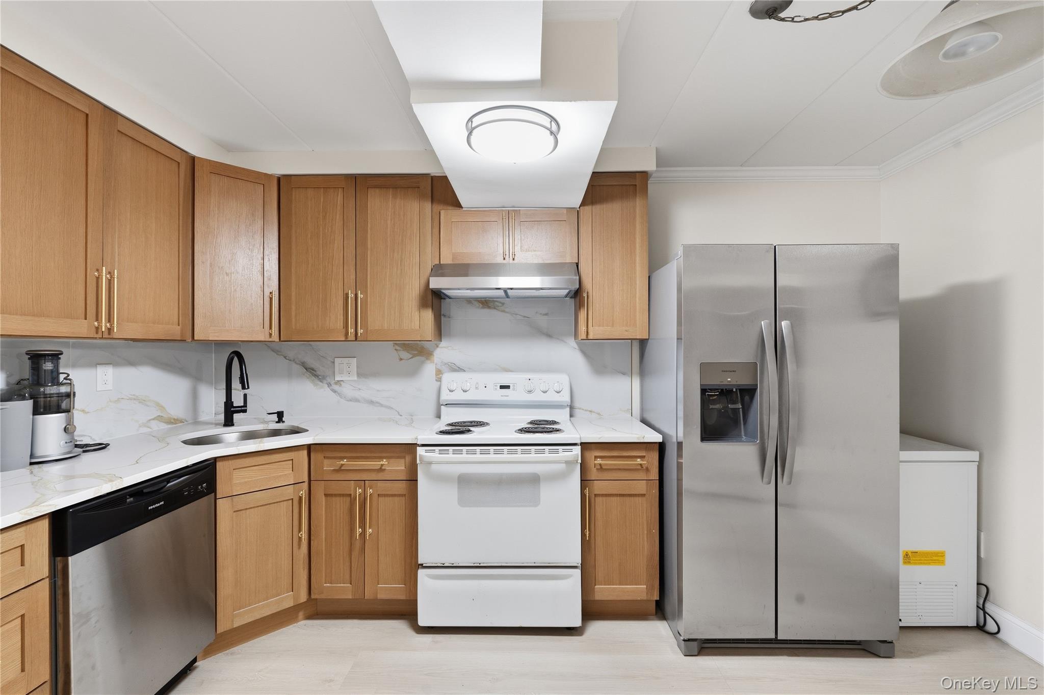 863 Home Street Bronx, NY 10459 - Photo 7 of 46 a kitchen with a stove sink and refrigerator