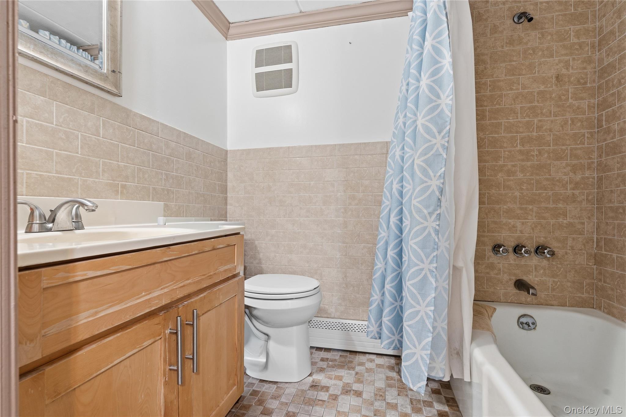 863 Home Street Bronx, NY 10459 - Photo 8 of 46 a bathroom with a sink toilet and shower