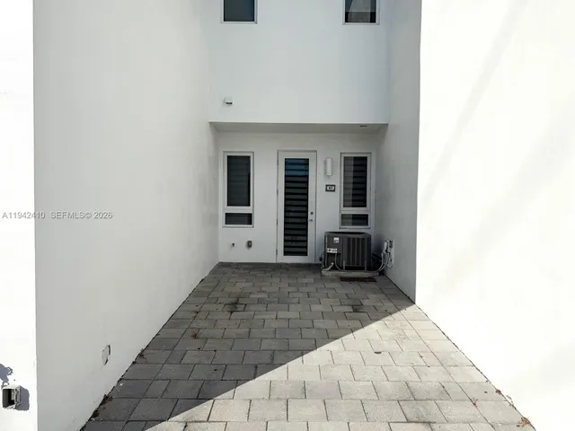a bathroom with a sink a shower and a mirror