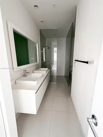 a view of a hallway with some shower