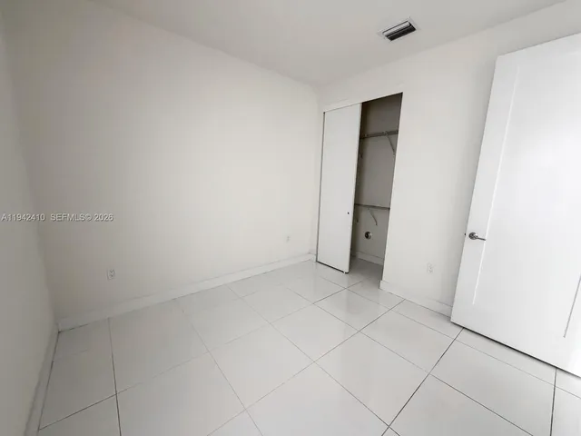 an empty room with a bathroom