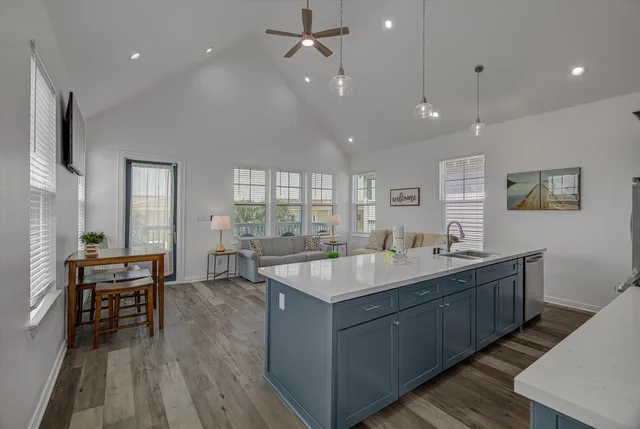 a kitchen with cabinets table and chairs